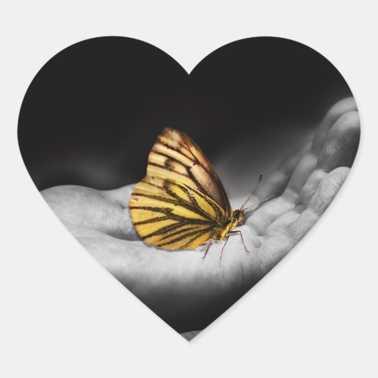 Vlinder bij de hand hart sticker (Voorkant)