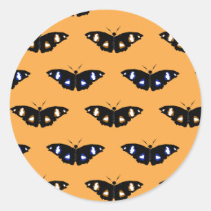 Vlinderpatroon op oranje achtergrond ronde sticker