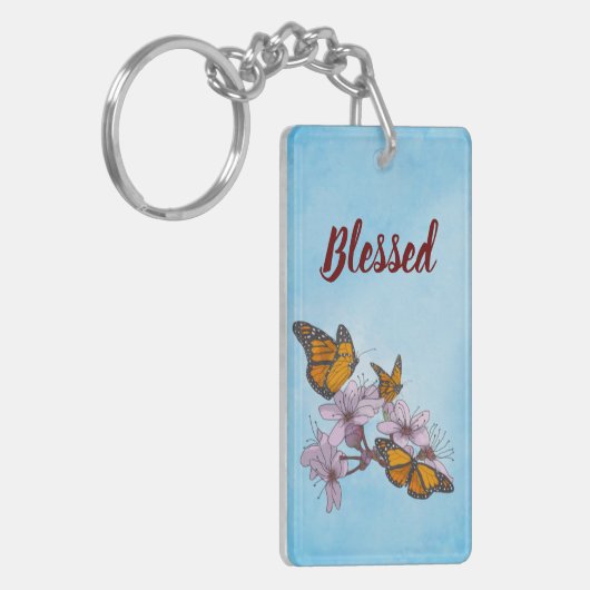 Vlinders en bloesems op blauwe achtergrond sleutelhanger (Voorkant Links)