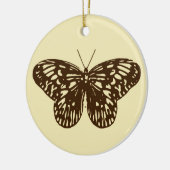 vlinderschets, chocoladebruin op beige keramisch ornament (Links)