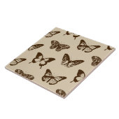 vlinderschets, chocoladebruin op beige tegeltje (Zijkant)