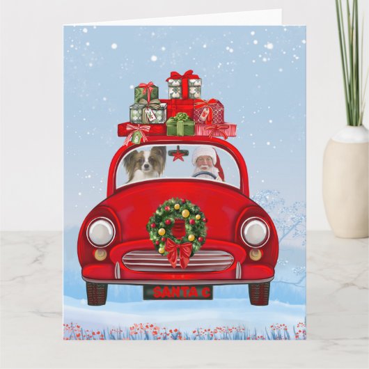 Vlindervlindhond in auto met kerstman kaart (Voorkant)