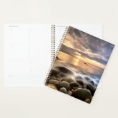 Vloeiende wateren op zonsondergang planner (Display)