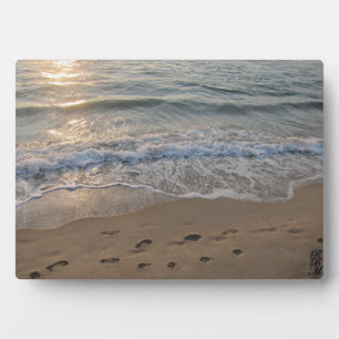 Voetafdrukken in het zand fotoplaat