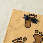 Voetafdrukken in het zand strandlaken (In situ)