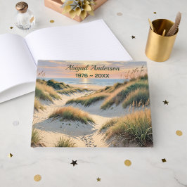 Voetafdrukken op strandduin gastenboek