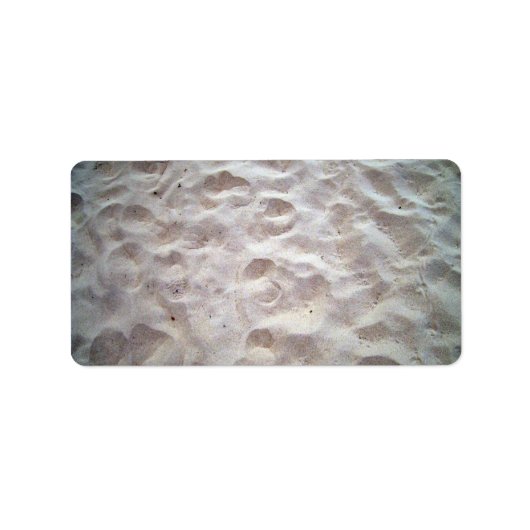 Voetafdrukken op zandtextuur etiket (Voorkant)