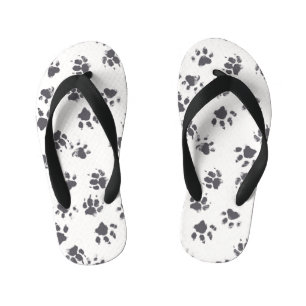 Voetafdrukken van poot: Hond monochroom naadloos. Kinder Teenslippers