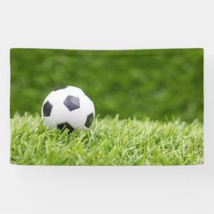 Voetbal is op de achtergrond van groene gras spandoek