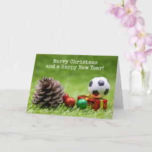 Voetbal Kerstvakantie met dennenappel en geschenke Kaart