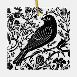 Vogel op een tak met bloemen in zwart en wit keramisch ornament