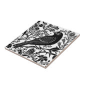 Vogel op een tak met bloemen in zwart en wit tegeltje (Zijkant)