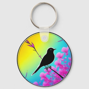 Vogel op een tak met levendige artistieke achtergr sleutelhanger