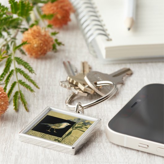 Vogel op zwarte en  achtergrond sleutelhanger (Zijkant)