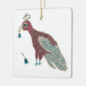 Vogel rood met blauwe bloemen keramisch ornament (Links)