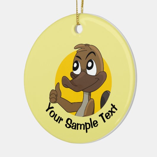 Vogelbekdier geeft duim omhoog keramisch ornament (Links)