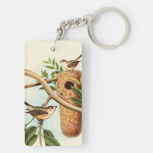 Vogelpaar op een nestveld op een tak sleutelhanger (achterkant)