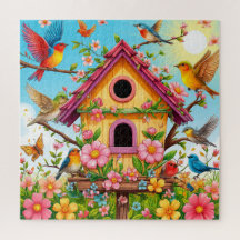 Vogels die rond een vogelhuisje zitten