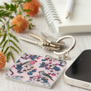 Vogels en bloesems op roze sleutelhanger