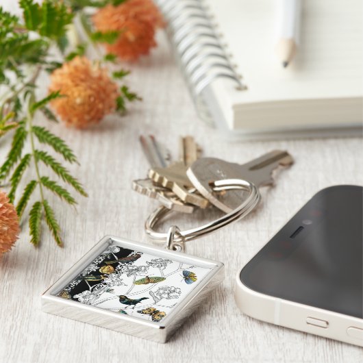 Vogels en vlinder op een zwarte en witte achtergro sleutelhanger (Zijkant)