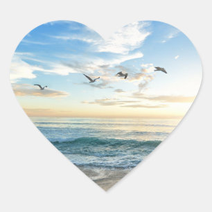Vogels in vlucht boven de oceaan hart sticker