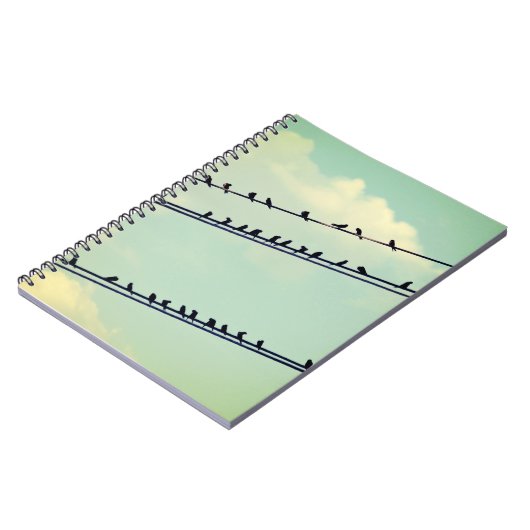 Vogels op draden, blauwe lucht. notitieboek (Linkerzijde)