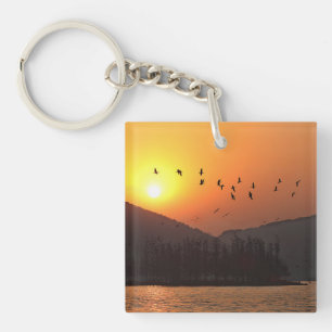 Vogels vliegen in Sunset Sky over East Lake Foto Sleutelhanger
