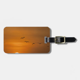 Vogels vliegen in zonsondergang bagagelabel