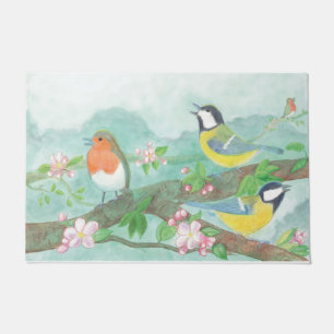 Vogels zingen op een bloeiende boomtak deurmat