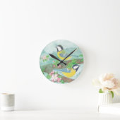 Vogels zingen op een bloeiende boomtak  ronde klok (Huis)