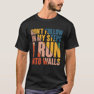 Volg mijn stappen niet in de muren t-shirt