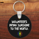 Volunteers bring sunshine to the world sleutelhanger (Voorkant)