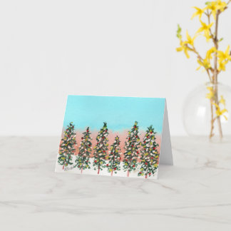 Voor de dageraad rij van kleurrijke kerstbomen kaart