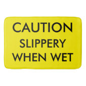 Voorzichtig. Slipperig wanneer nat. Badmat (Voorkant)
