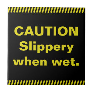Voorzichtig. Slipperig wanneer nat. Tegeltje