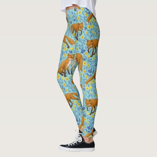 Vossen en boterbloemen op zwembad blauw leggings (Links)