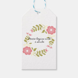 Vrede begint met een glimlach en roze bloemen cadeaulabel