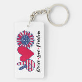 Vrede. Liefde. Vrijheid. Acryl sleutelhanger (achterkant)