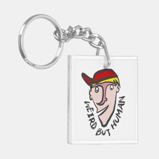 Vreemd, maar menselijk sleutelhanger (Voorkant Links)