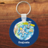Vreemde astronaut in de ruimte en de cartoon sleutelhanger (Voorkant)