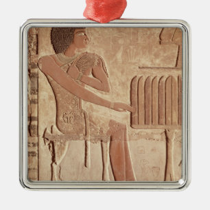 Vrijstelling waarin de overleden zitting is afgebe metalen ornament