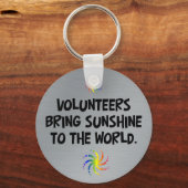 Vrijwilligers brengen zonneschijn naar de wereld sleutelhanger (Voorkant)