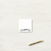 Vroege kerstgroet mistletoe en dennenpoep post-it® notes (Op bureau)