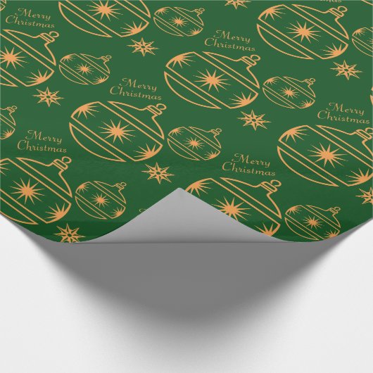 Vroege kerstversieringen op groen cadeaupapier (Hoek)