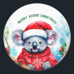 Vrolijk Aussie Kerstmis Koala Ronde Sticker<br><div class="desc">Een zeer vrolijke Aussie Kerstmis met deze schattige koala Deze harige koala is een inwoner van Australië ze zijn gemakkelijk te herkennen aan hun stevige,  staartloze lichaam en grote kop met ronde,  pluizige oren en grote,  lepelvormige neus.</div>