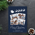 Vrolijk Kerstfeest 4 Foto Santa Sleigh Blue Feestdagenkaart<br><div class="desc">Feestelijke blauwe kerstkaart met een 4 foto collage van afbeeldingen verspreid in witte lijsten,  een silhouet van rendieren vliegen Santa's slee,  "Merry Christmas" in een stijlvol wit script en jouw naam in eenvoudige witte typografie.</div>