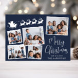 Vrolijk Kerstfeest 5 Foto Santa Sleigh Blue Feestdagenkaart<br><div class="desc">Feestelijke blauwe kerstkaart met een 5 foto collage van verspreide afbeeldingen in witte lijsten,  een wit silhouet van rendieren die Santa's slee vliegen,  "Merry Christmas" in een stijlvol wit script en jouw naam in eenvoudige moderne witte typografie.</div>