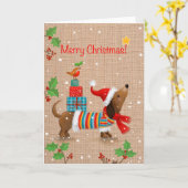 Vrolijk kerstfeest, hond met geschenken op zijn ru kaart (Gele Bloem)