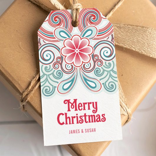 Vrolijk kerstfeest label met rode en groene bloeme cadeaulabel