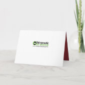 Vrolijk kerstfeest met rood gekleurd chiropractisc feestdagen kaart (Achterkant)